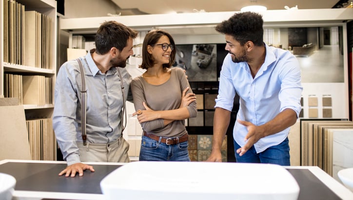 A couple has a consultation with a bath retailer